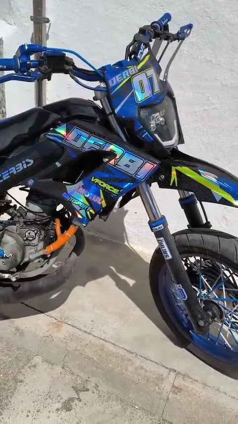 Supermoto with a blue and yellow graphics kit