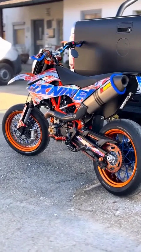 Supermoto with a orange and blue graphics kit