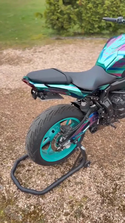 Naked bike with a turquoise graphics kit