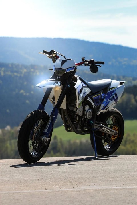 Supermoto with a white and blue graphics kit