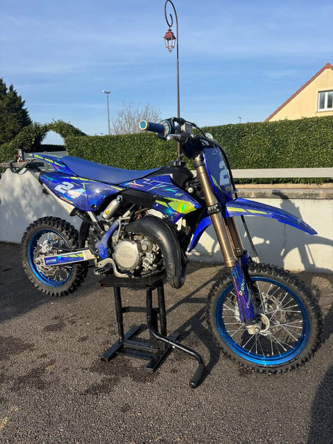Dirt bike with a blue graphics kit