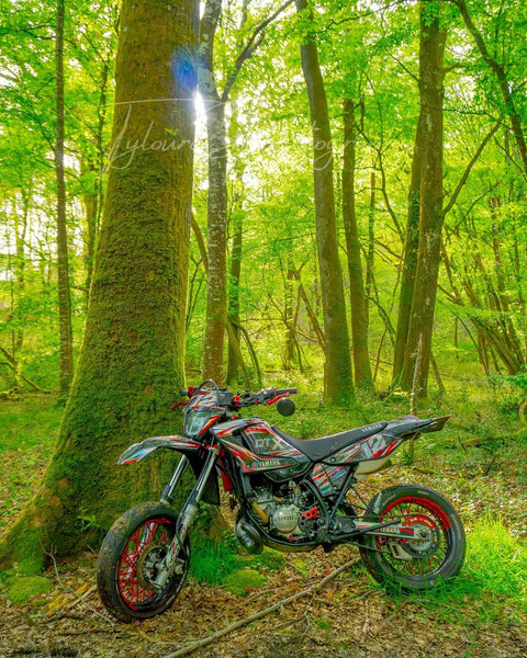 Supermoto with a green and black graphics kit