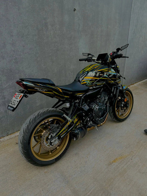 Naked bike with a black and gold graphics kit