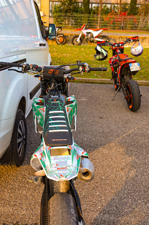Supermoto with a green and white graphics kit